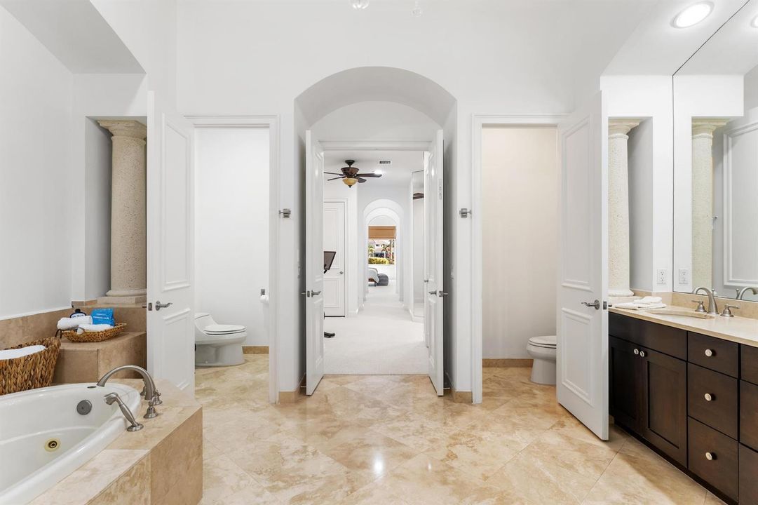 Primary Bathroom His Her Comodes