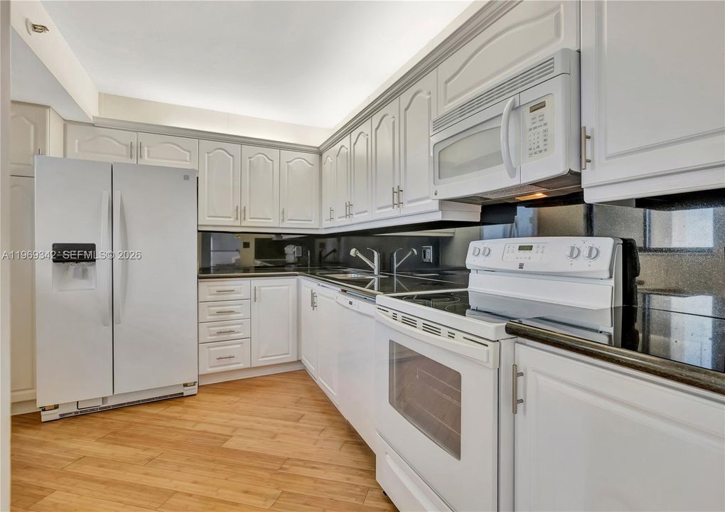 White cabinets, Absolute Black granite, Bamboo floors