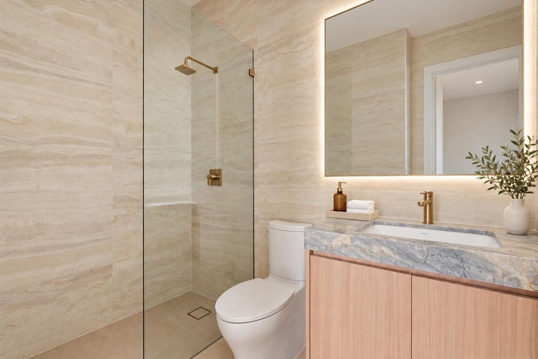 Polished Luxury Bathroom With Brass Fixt