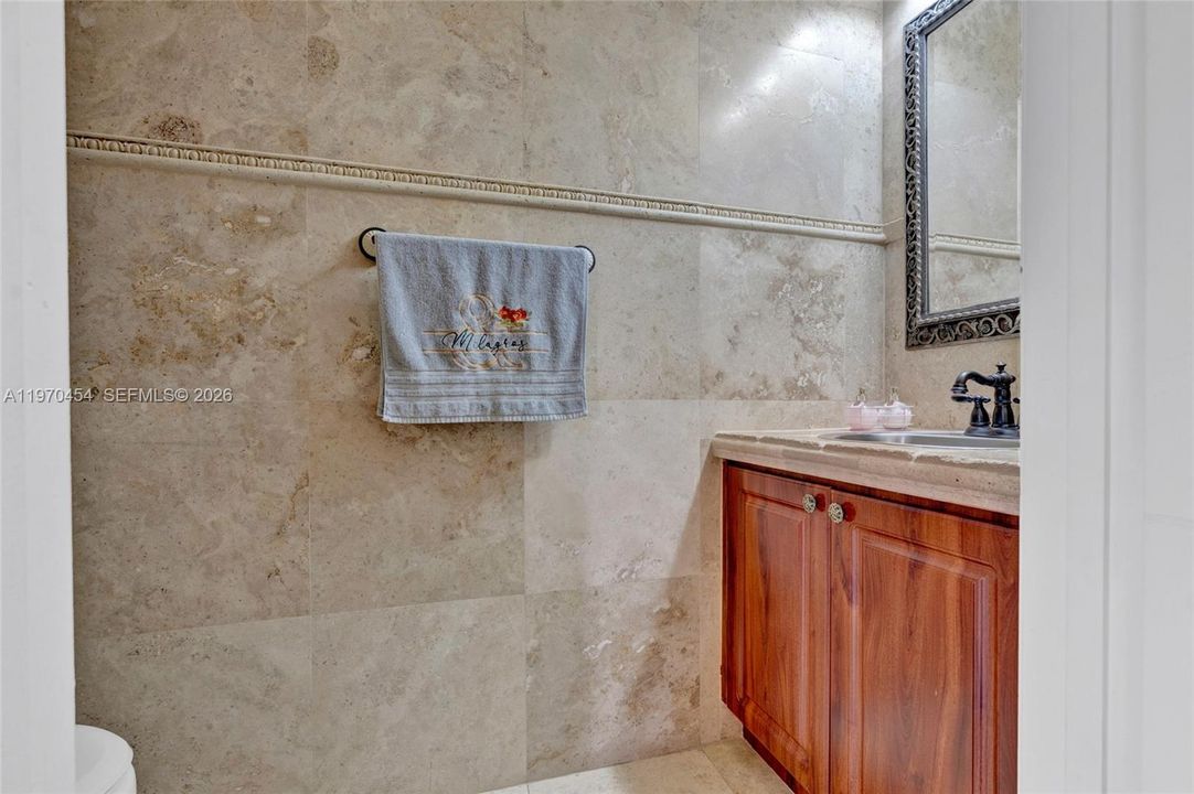 Half bathroom next to living room