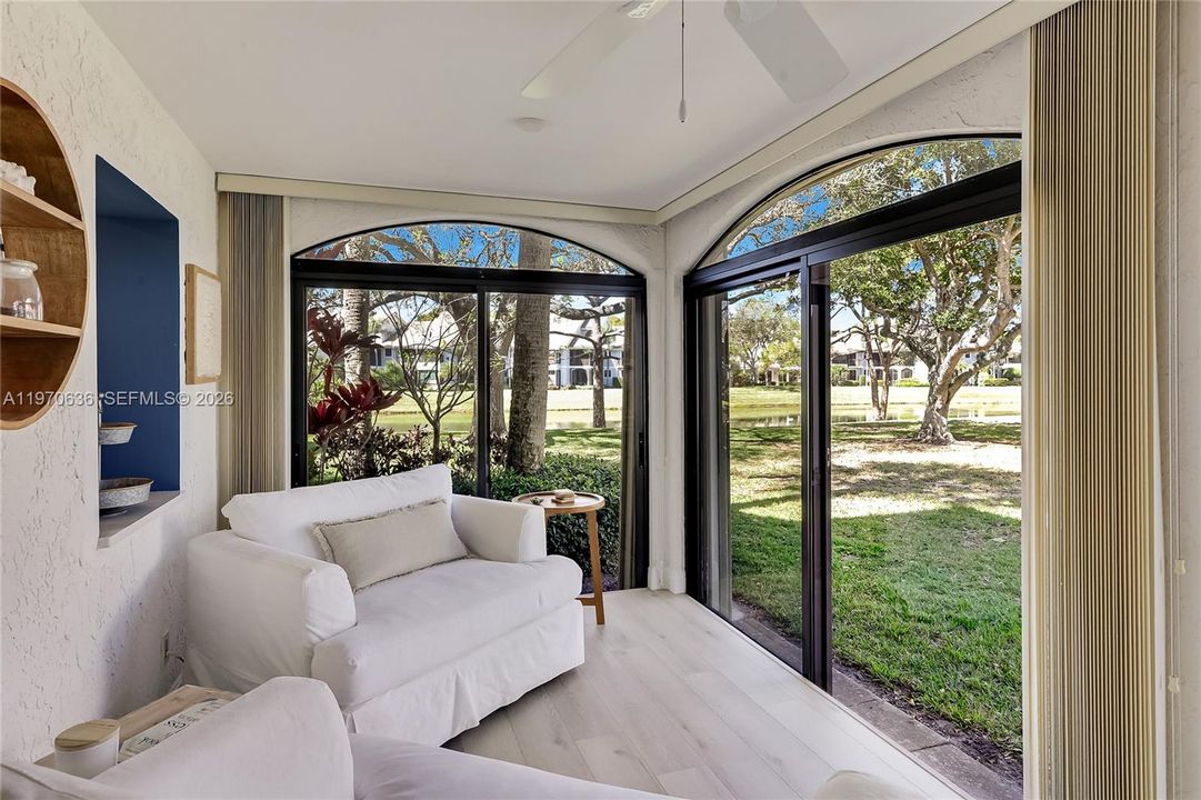 Light filled Florida Room with lake view