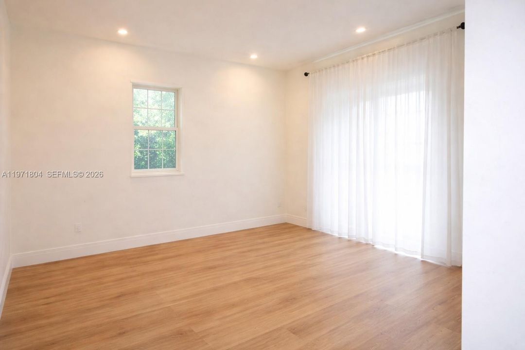 Back room, overlooking pool-movie/den area