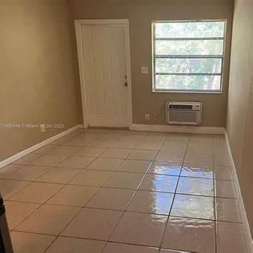 Open concept design leading to kitchen.