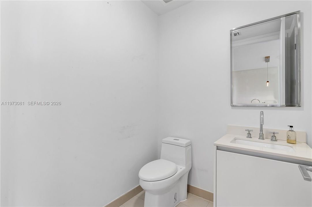 Guest Bathroom.Unit will be freshly painted prior to closing, delivering the residence in clean, move-in ready condition.