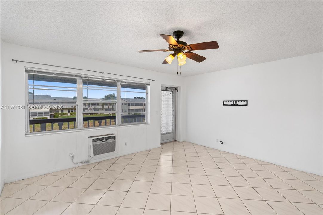 Bright living room with well-maintained AC for added comfort
