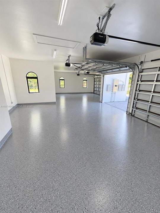 Garage will have epoxy floor. AI Staged.