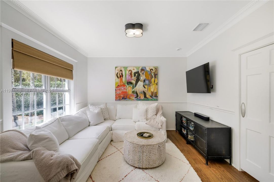 Private TV room alcove allows for privacy while remaining part of the family.