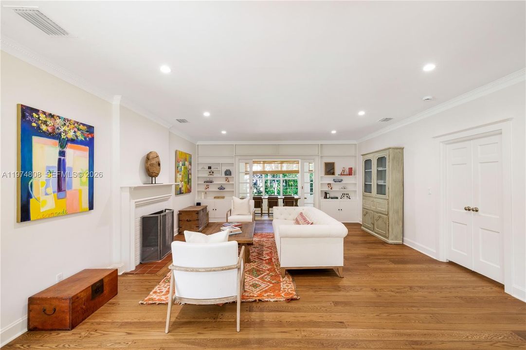 Additional living room area adjacent to the dining area showcasing easy flow for entertaining.