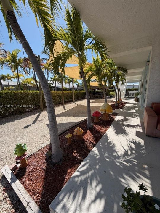 Driveway on side entrance, porch, and path to 1st floor access