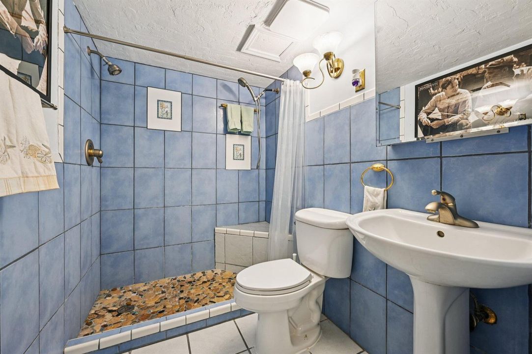 Retro tiled full bathroom with shower
