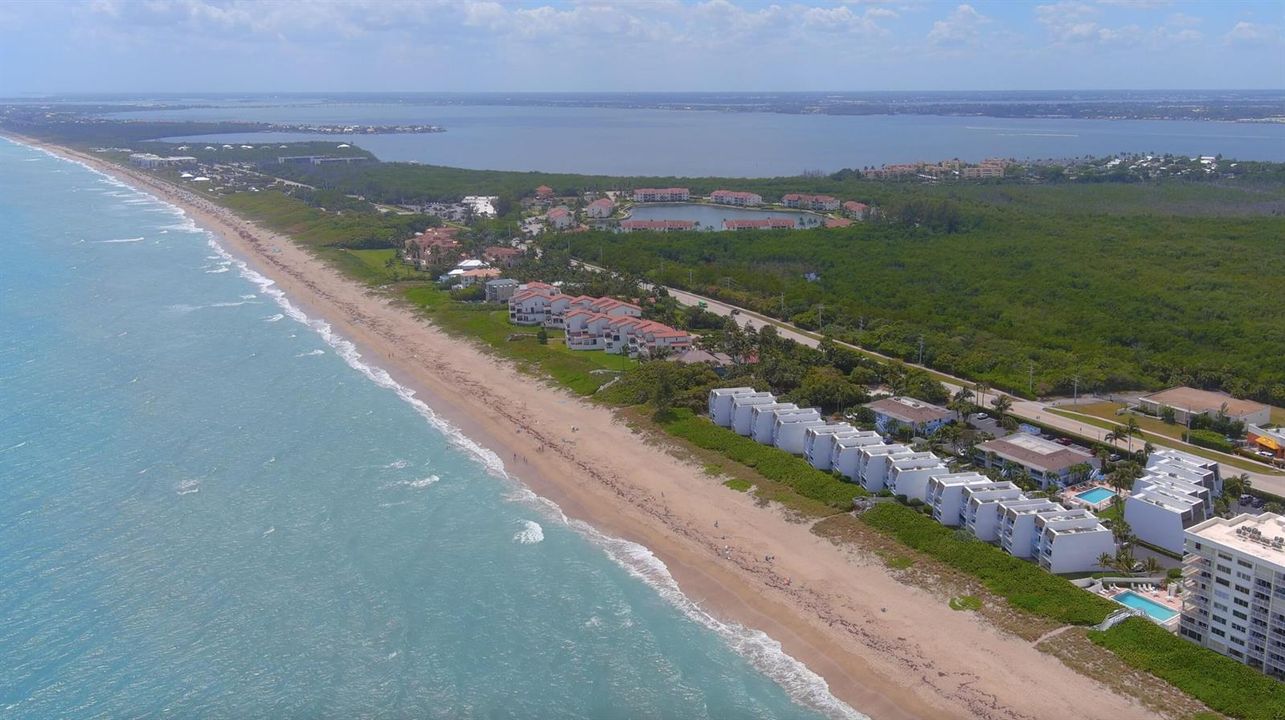 Long aerial stretch of ocean & island