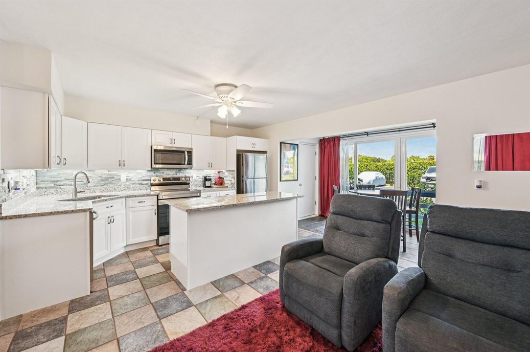 Living area with kitchen and recliners