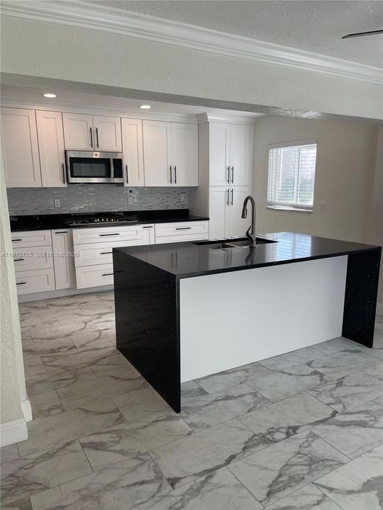 Island is ideal for family gatherings and meal prep!