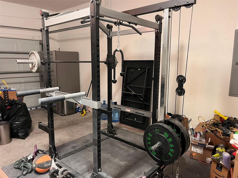 Spare fridge & exercise equipment included with house!