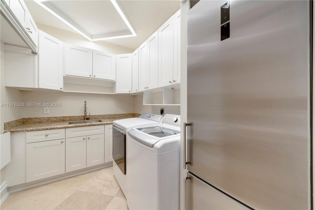There are 2 laundry areas: upstairs and on the ground level.