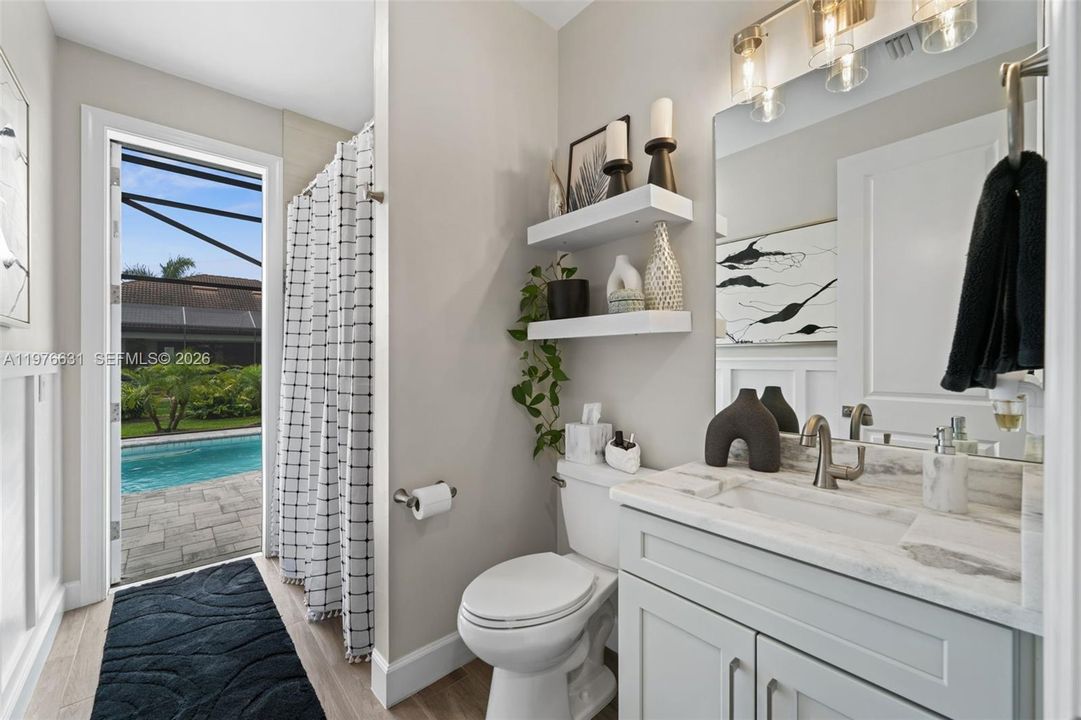 Guest bath with access to the lanai and pool