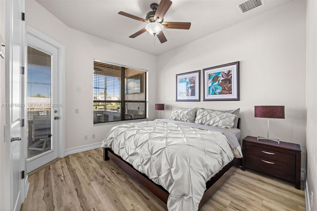 Guest Bedroom with door to the pool