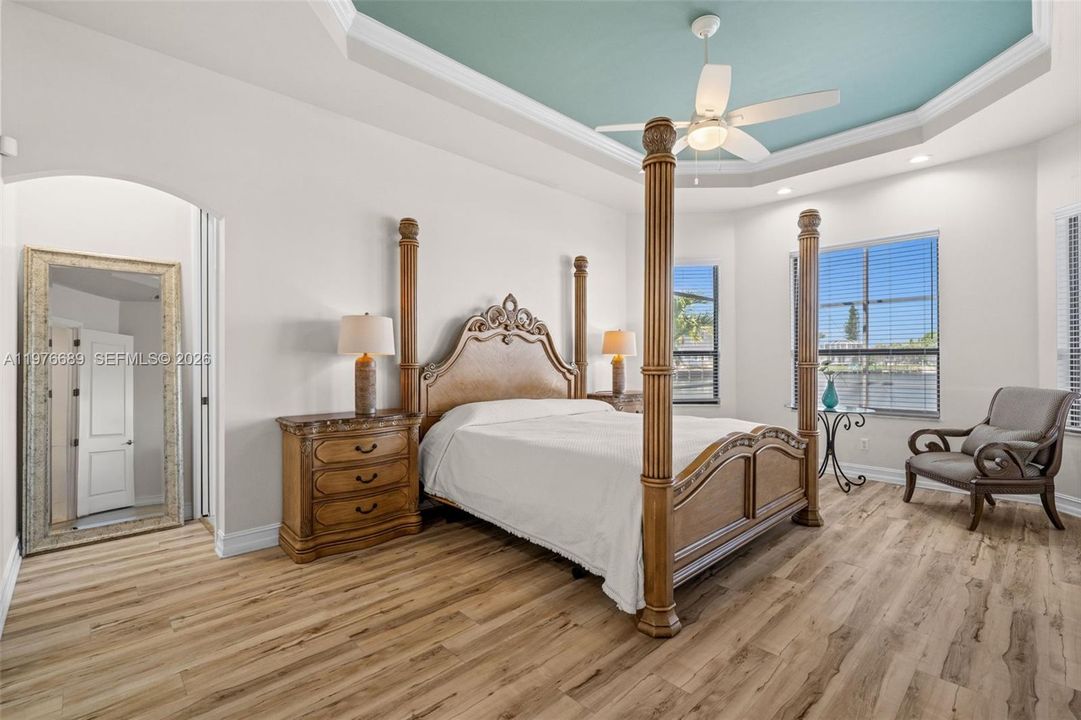 Primary Bedroom with tray ceilings and 2 large walk-in closets