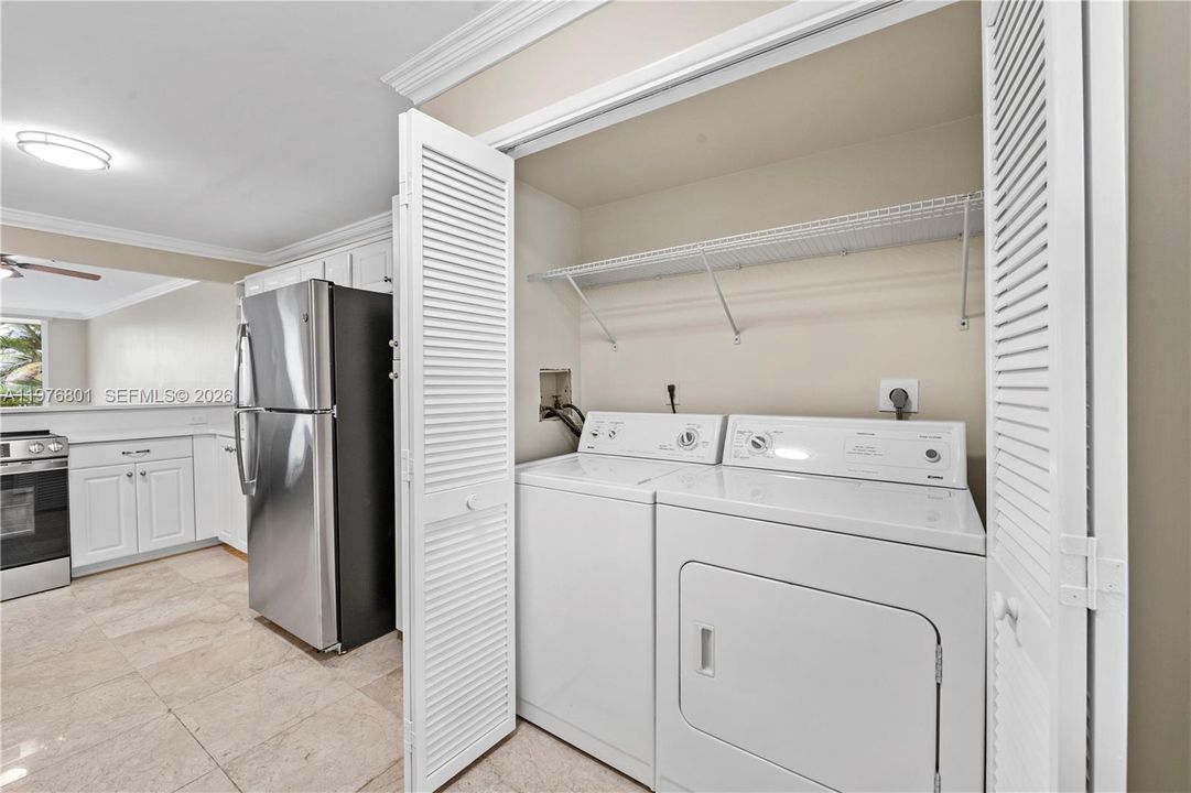 Laundry area includes washer and dryer