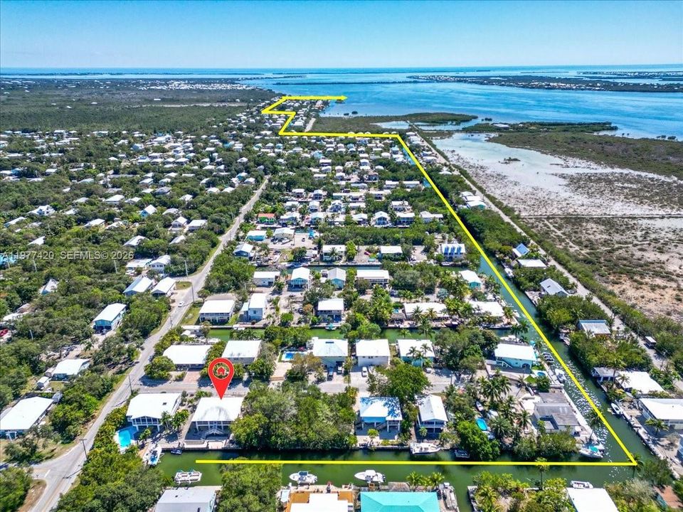 Aerial view highlighting the home’s location within the Eden Pines canal neighborhood.