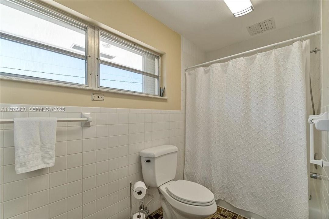 Primary bathroom serving the main bedroom.