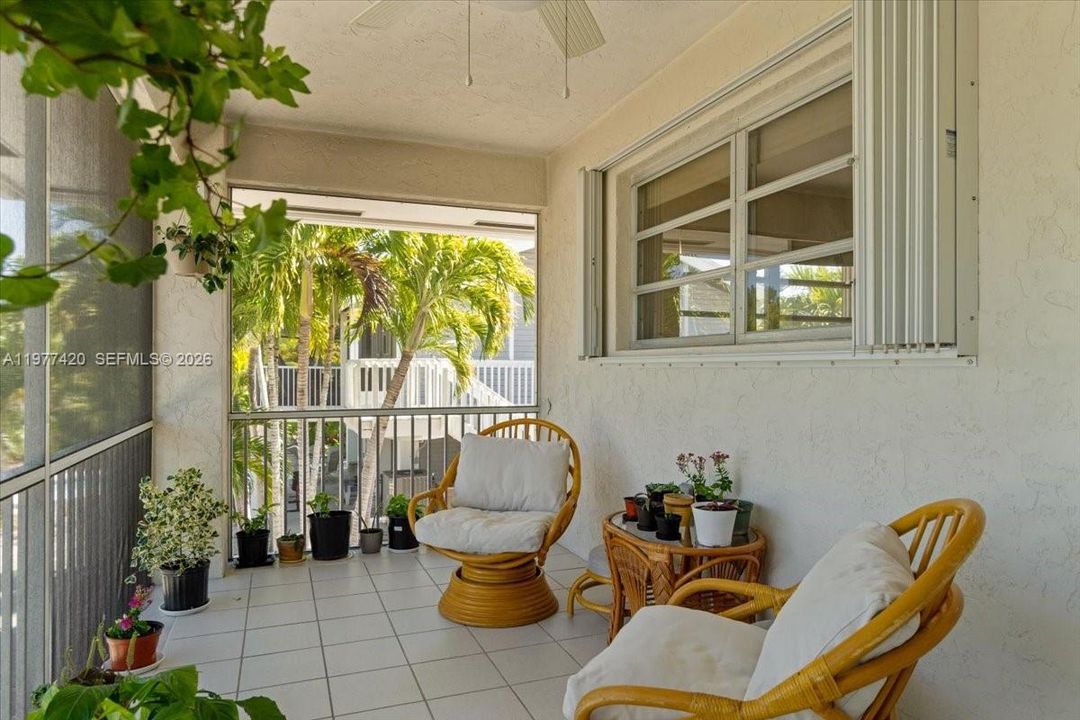 Screened porch overlooking the canal—perfect for relaxing outdoors.