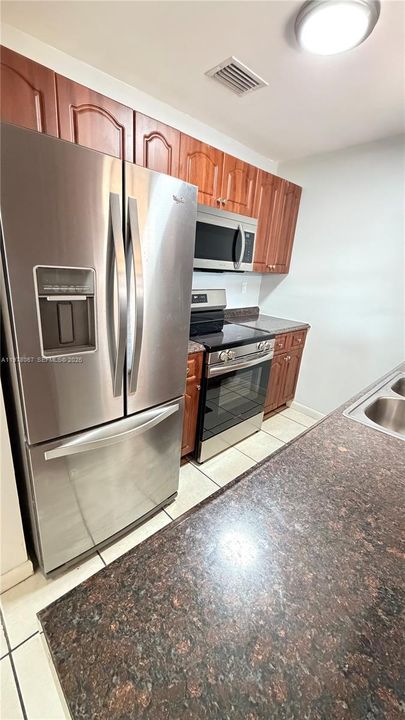 Stainless steel refrigerator, stove and microwave