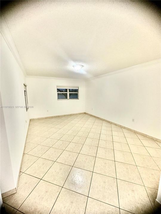 SPACIOUS PRIMARY BEDROOM SUITE WITH 2 WINDOWS: ONE WITH VIEWS OF LAKE/GARDEN & THE OTHER OF PATIO-LARGE ENOUGH SPACE FOR SITTING AREA TOO (LOOKING FROM ENSUITE DOUBLE SINK VANITY AREA)