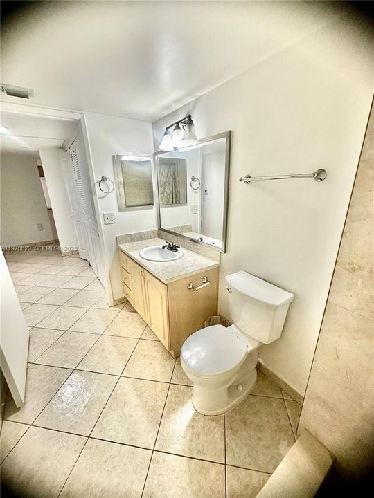 ANGELED VIEW FROM SHOWER-SHOWS ADDITIONAL WALL MOUNTED CABINET, TOWEL BARS & TP HOLDER