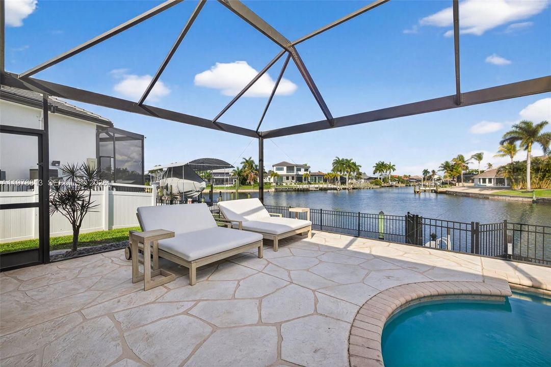 Sunning area, heated pool, serene water views, picture window screens