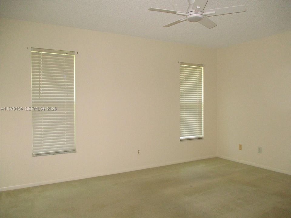 MASTER BEDROOM WITH SLIDING DOOR TO PATIO
