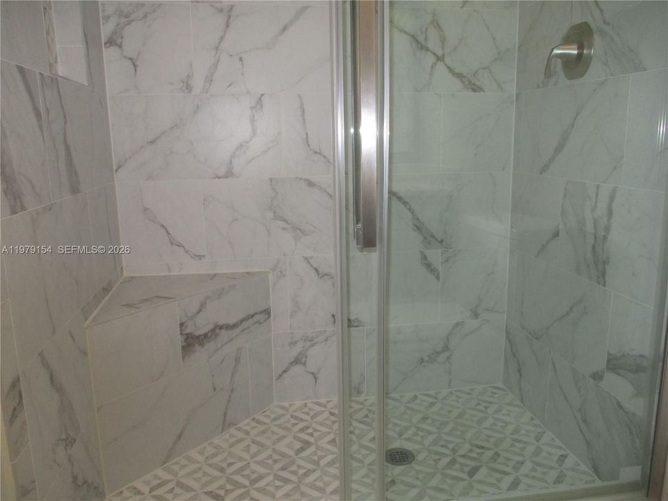 CUSTOM-MADE SHOWER WITH SEAT & SLIDING DOOR