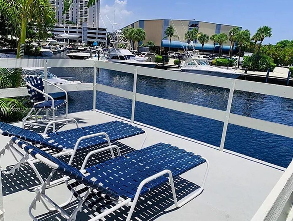 Waterfront sundeck with adjacent barbecue area
