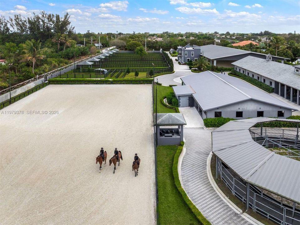Lighted outdoor arena (175' x 275') with special Equestrian footing and sprinklers.