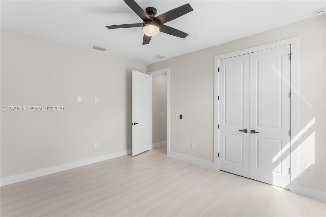 SPLIT LAYOUT offers SECOND PRIMARY SUITE w/ POOL BATHROOM & TWO GUEST BEDROOMS w/ HALL BATHROOM for added privacy.