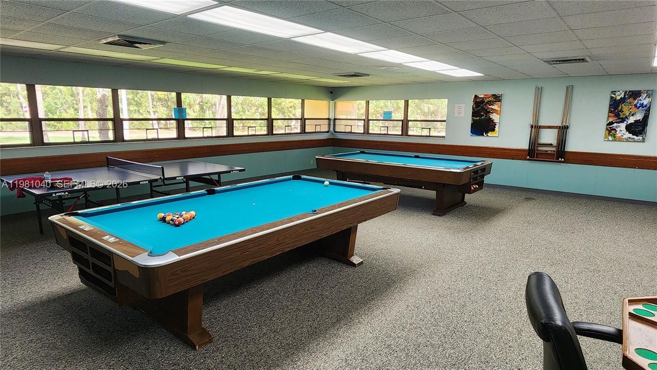 Game room with pool and ping pong tables