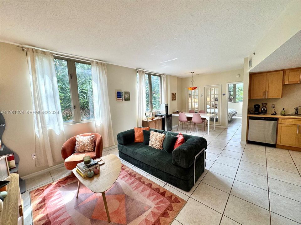 Bright open floor plan with convenience of "powder room" entry from main living area for visiting guests.