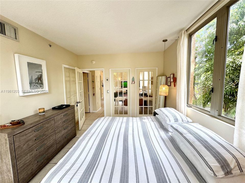Private bedroom amidst the lush canopy is serene, peaceful and private from the outside.