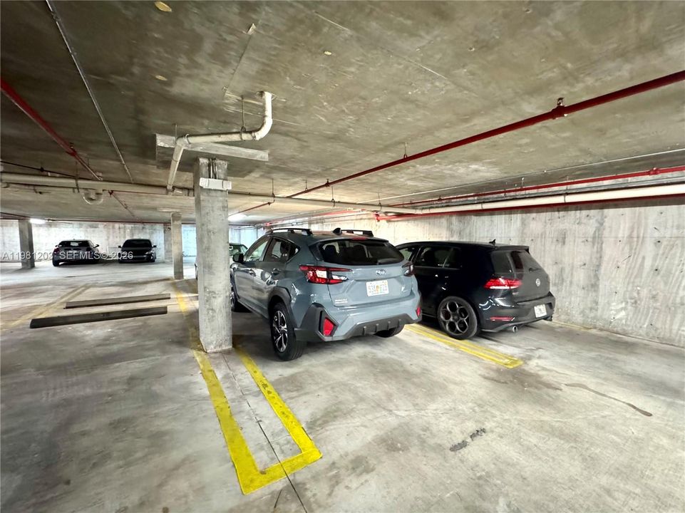 The assigned garage space is pictured here, SUV, and the adjacent space is rarely used so often available.