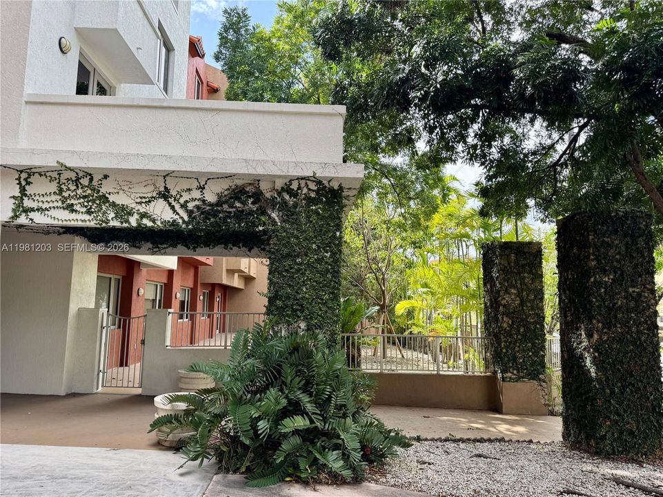 Charming and alluring front, side and rear elevations of this unique boutique building set amidst lush tropical flora and fauna.