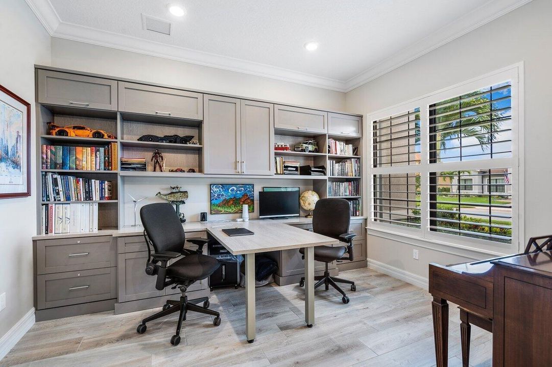 Office with custom desk and cabinetry