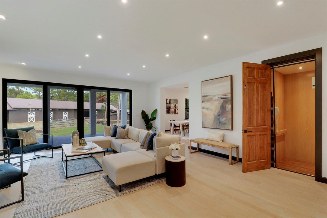 living room showing barn and elevator