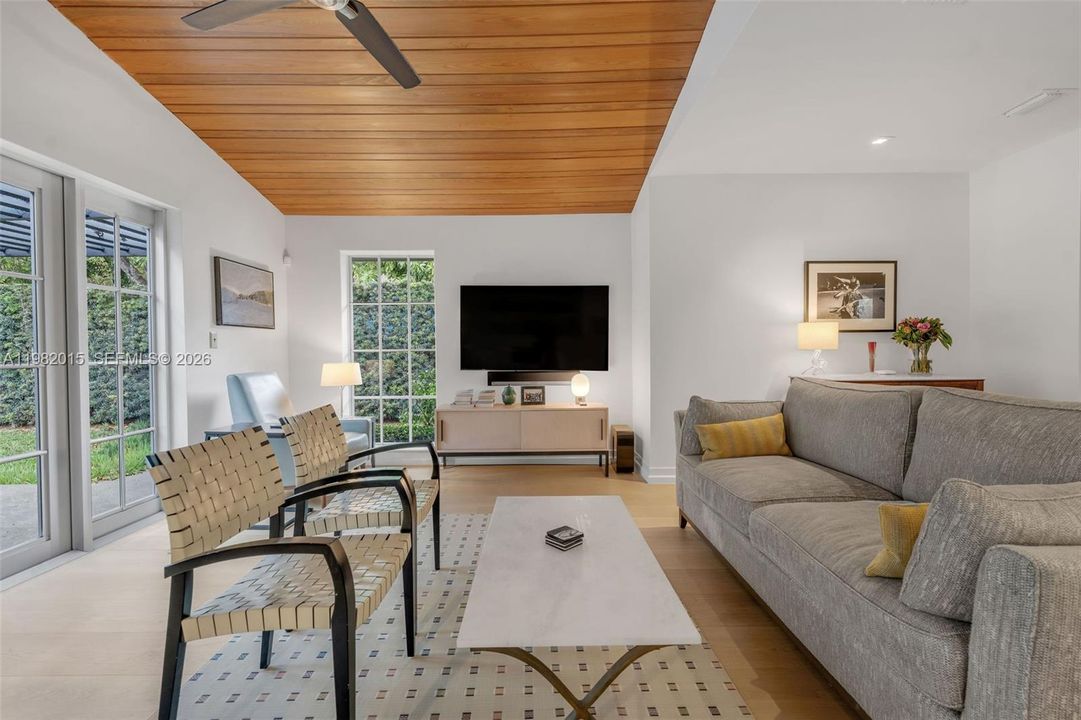 Sitting Room with High Wood Beam Ceilings