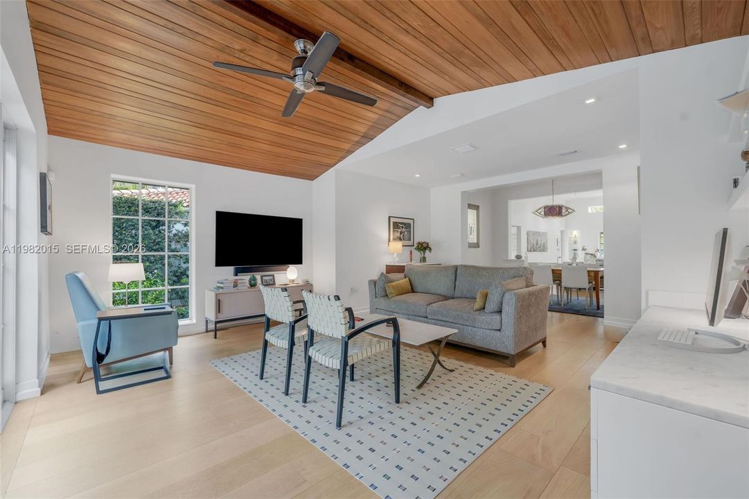 Sitting Room with High Wood Beam Ceilings