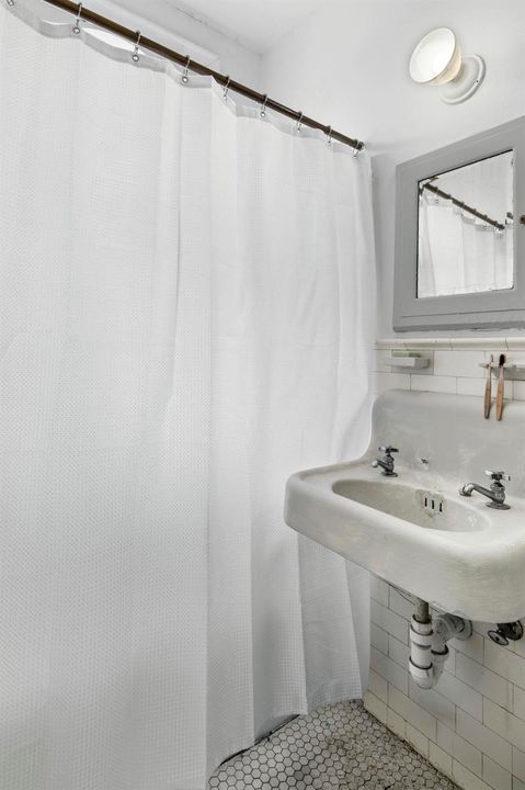 Bathroom with combo shower/tub