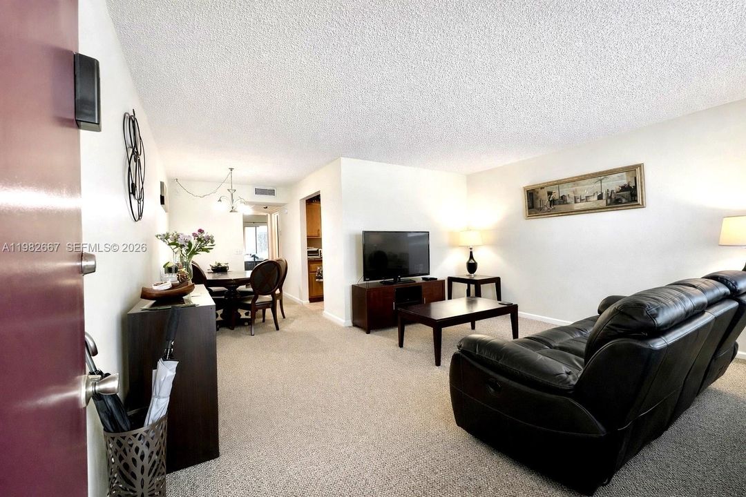 Bright and spacious living room with natural light and open layout.