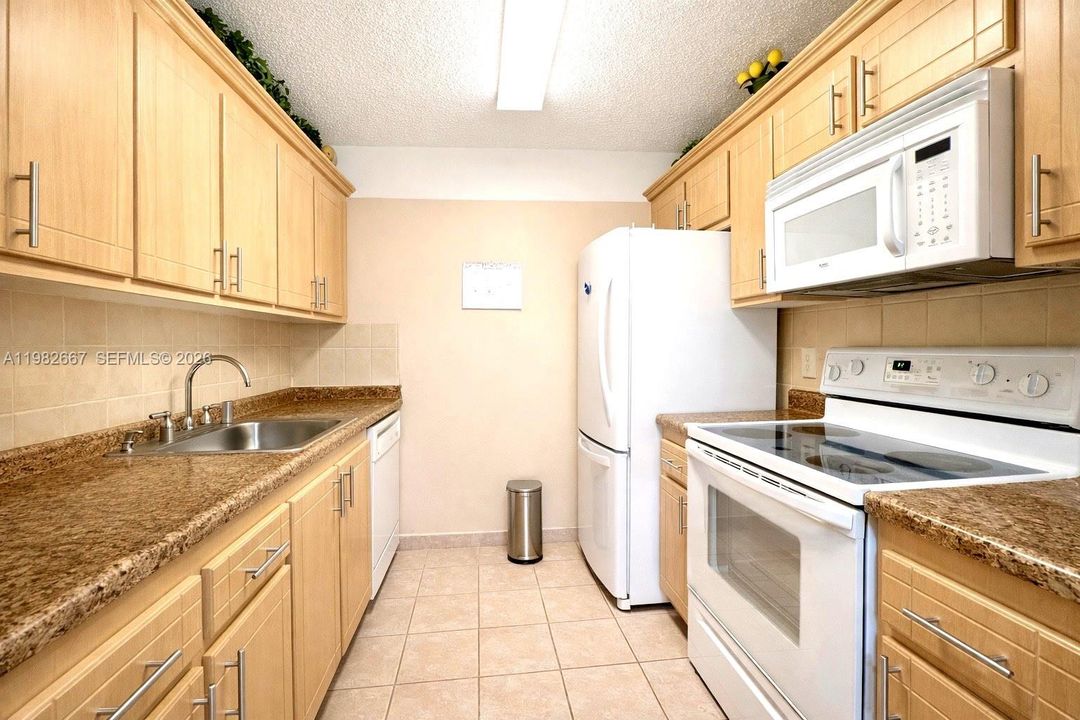 Well-maintained kitchen with ample cabinetry and counter space.