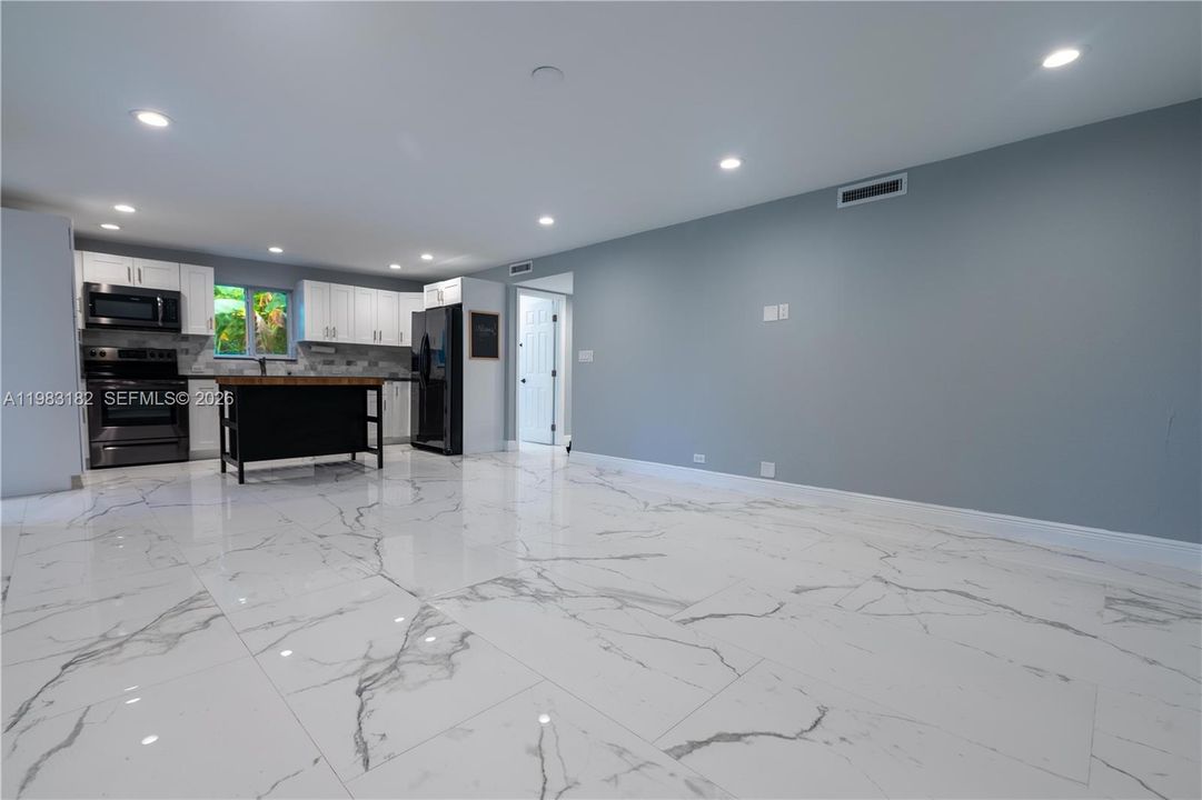 Bright open kitchen, dining, and living area perfect for entertaining.