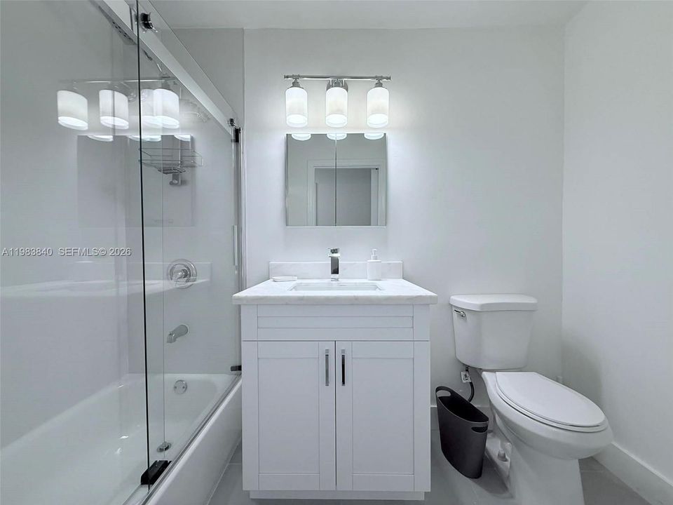 Guest bathroom with bathtub.