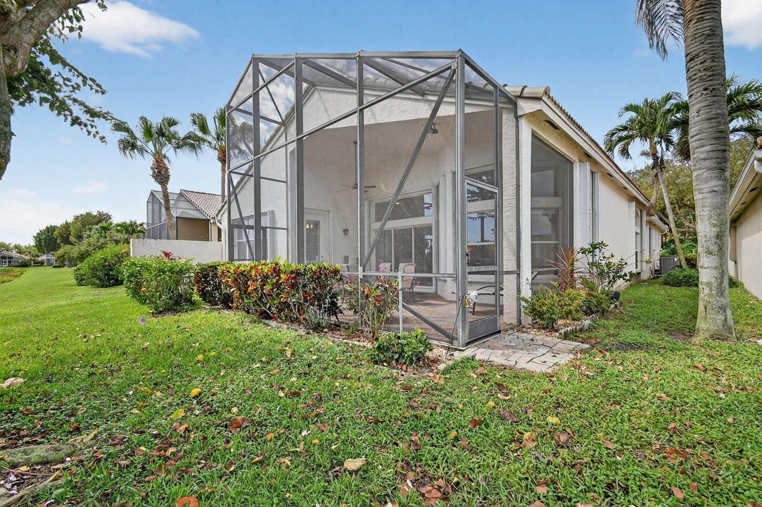 REAR OF HOME WITH SIDE YARD
